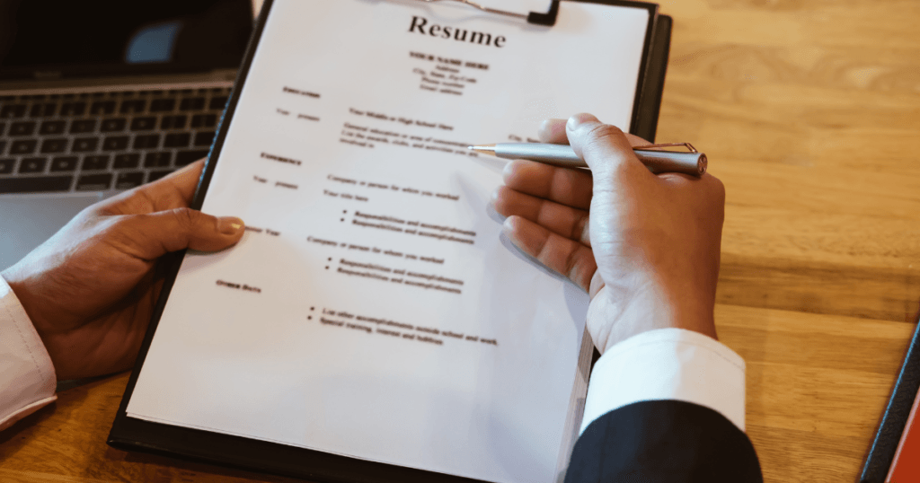 An employer checking through a resume for How International Students Can Explain Overseas Work Experience on a CV